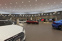 Custom LED lighting fixtures in automotive retail showroom