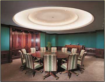 Office Video Teleconference room with round table and cove lighting